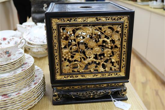 A late 19th/early 20th century Chinese giltwood and black lacquer incense stand